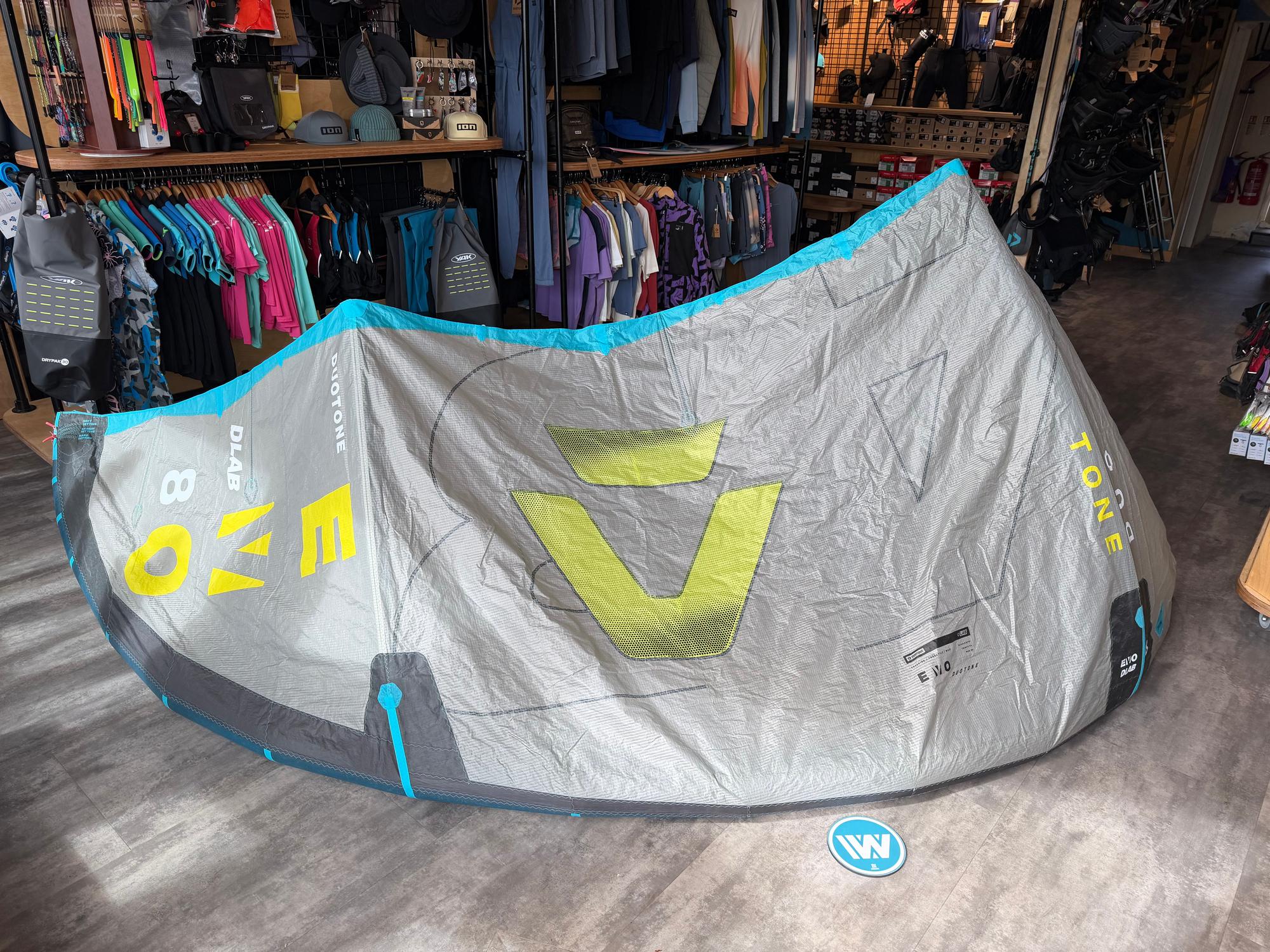 Used 8m Duotone Evo DLAB kite in grey and blue with yellow branding, featuring Aluula material and Trinity TX canopy.