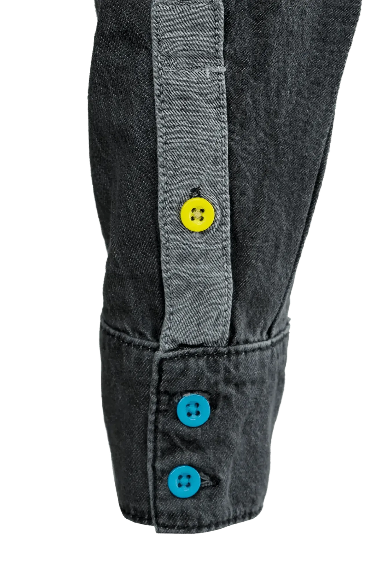 Black denim long sleeve shirt cuff featuring a grey placket with a yellow button and two blue buttons on the sleeve.