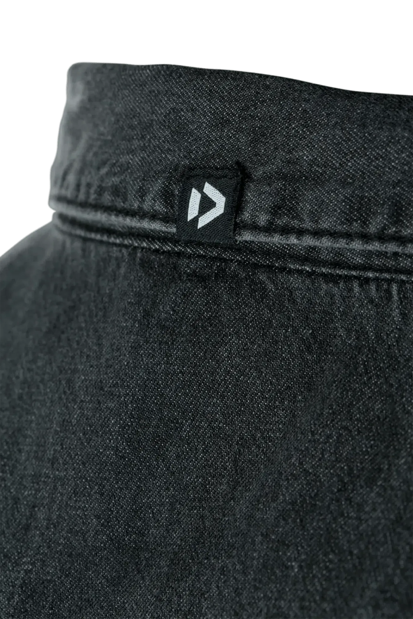 Black denim long sleeve shirt collar featuring a small Duotone logo tab on the back neck seam.