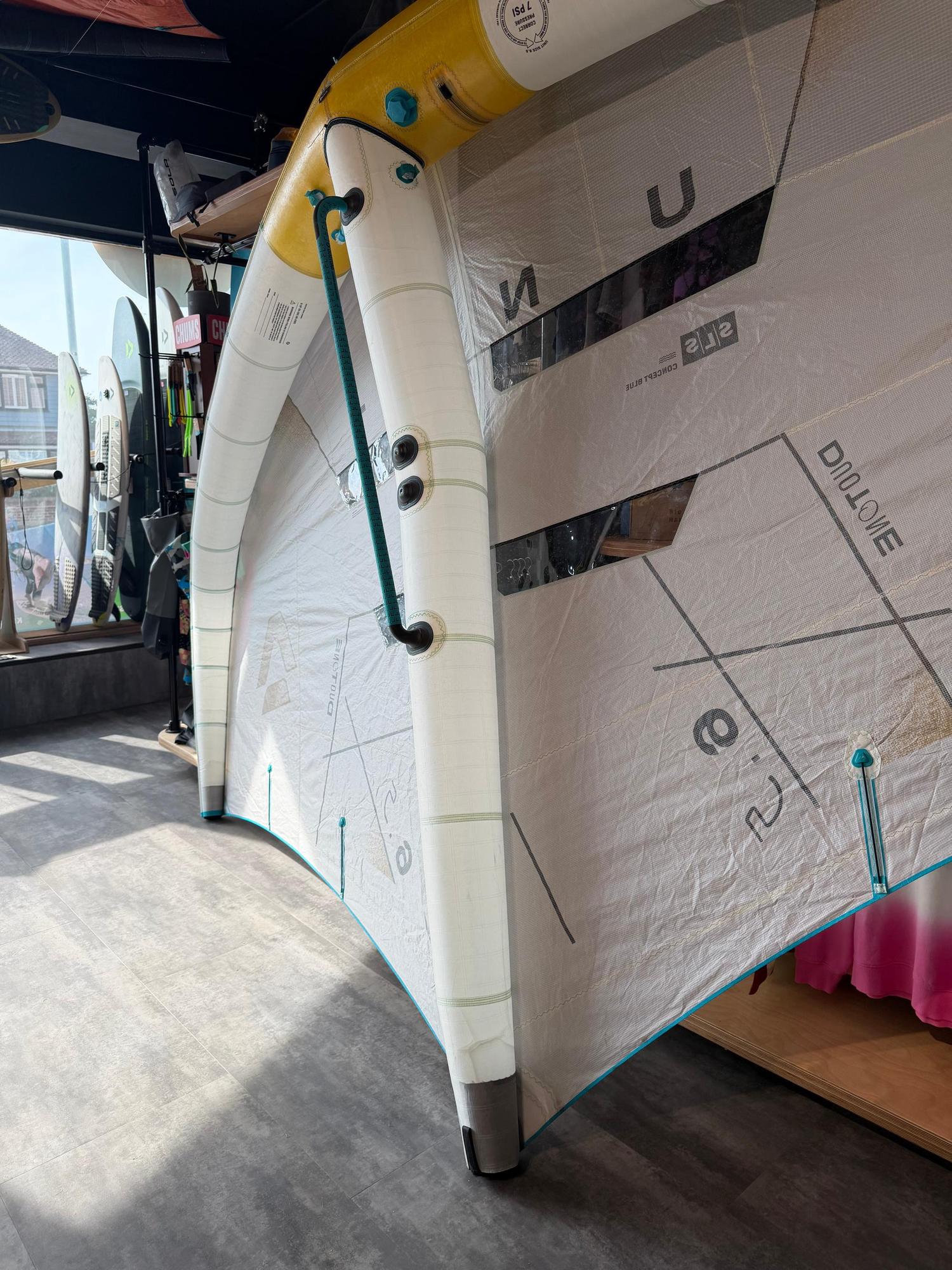 Used Duotone Unit SLS 6.5m Concept Blue wing with white canopy, yellow leading edge, and fitted fusion boom.