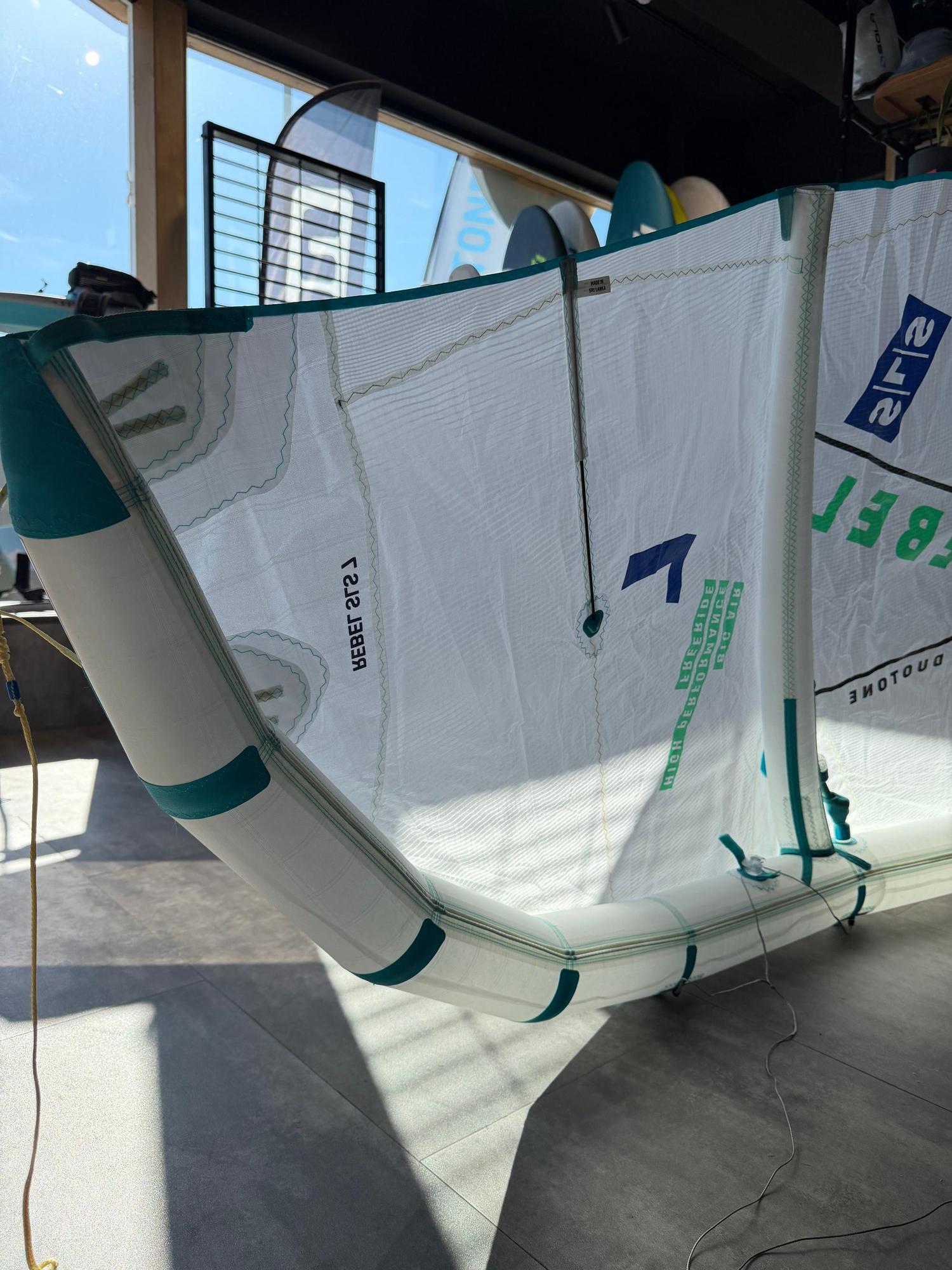 Used 7m Duotone Rebel SLS Concept Blue kite in white with teal accents, featuring high-performance Big Air branding.