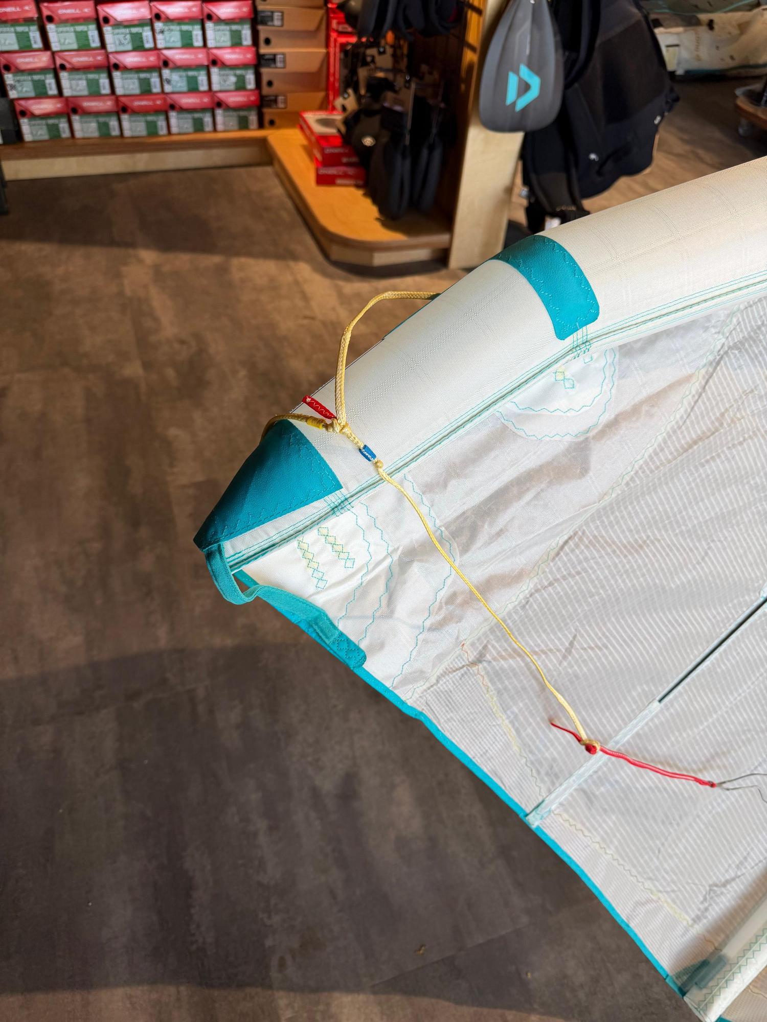 7m Duotone Rebel SLS Concept Blue kite featuring white undyed fabric, teal accents, and durable Penta TX material.