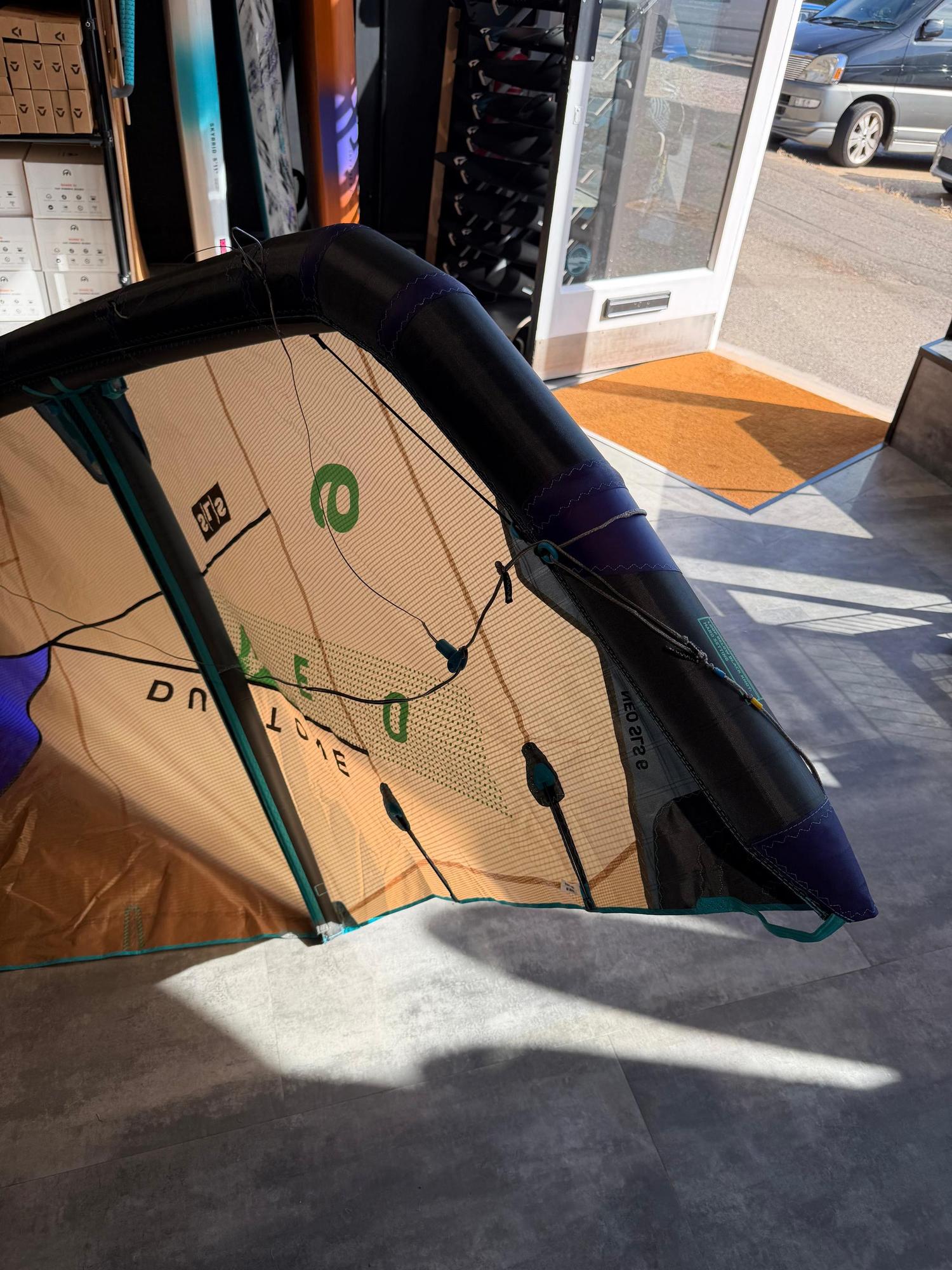 Used 6m Duotone Neo SLS wave kite in tan and black with Penta TX material, showing strut detail and branding.