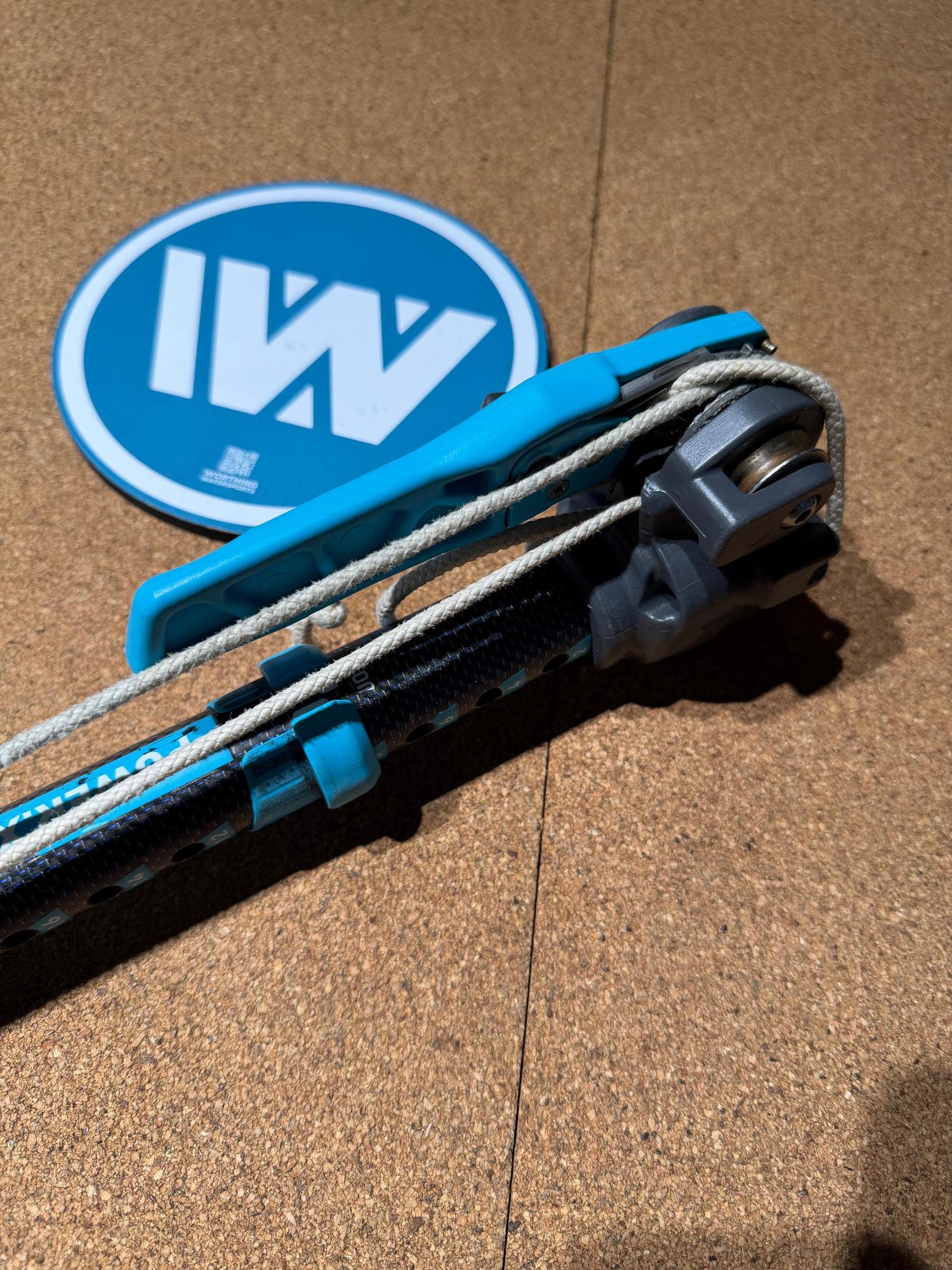 Used Duotone Power.XT 2.0 SLS carbon RDM windsurfing extension with integrated blue ratchet lever and downhaul rope.