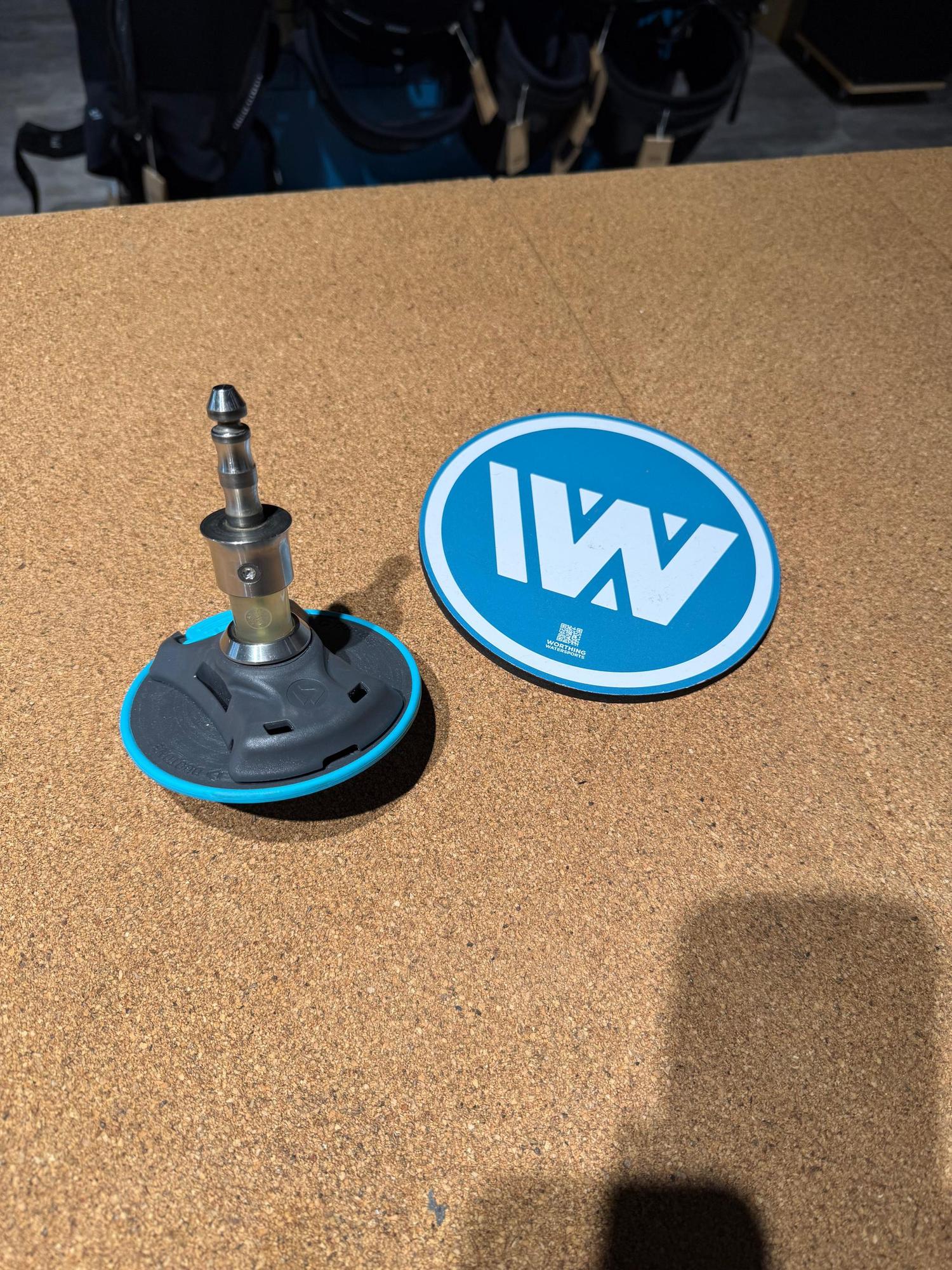 Used Duotone iBase 2.0 with iTendon 2022 featuring a grey base, blue trim, and metal connector on a cork surface.