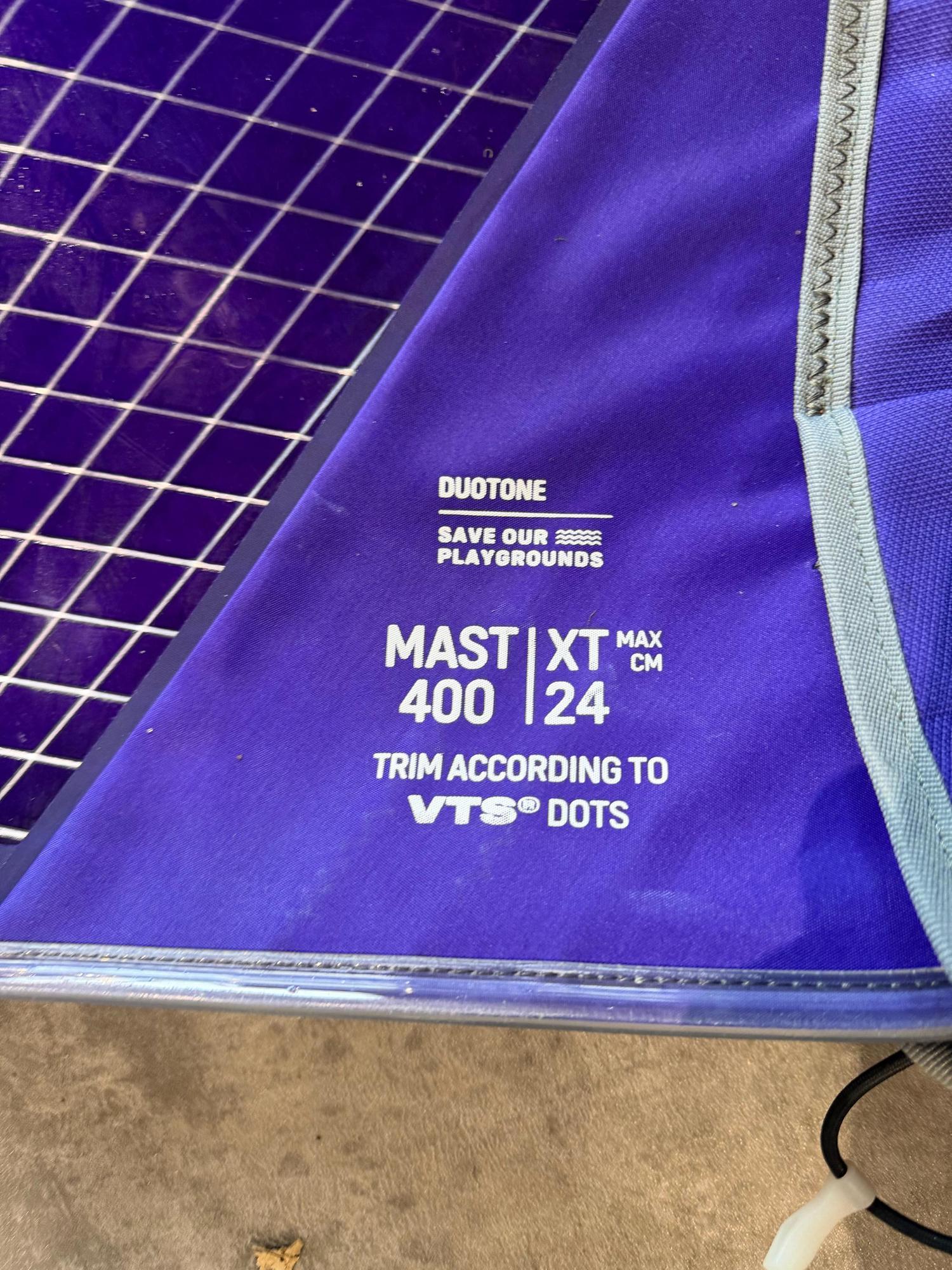 Purple Duotone X_Pace windsurf sail detail showing mast 400 and extension 24cm specifications on the fabric panel.