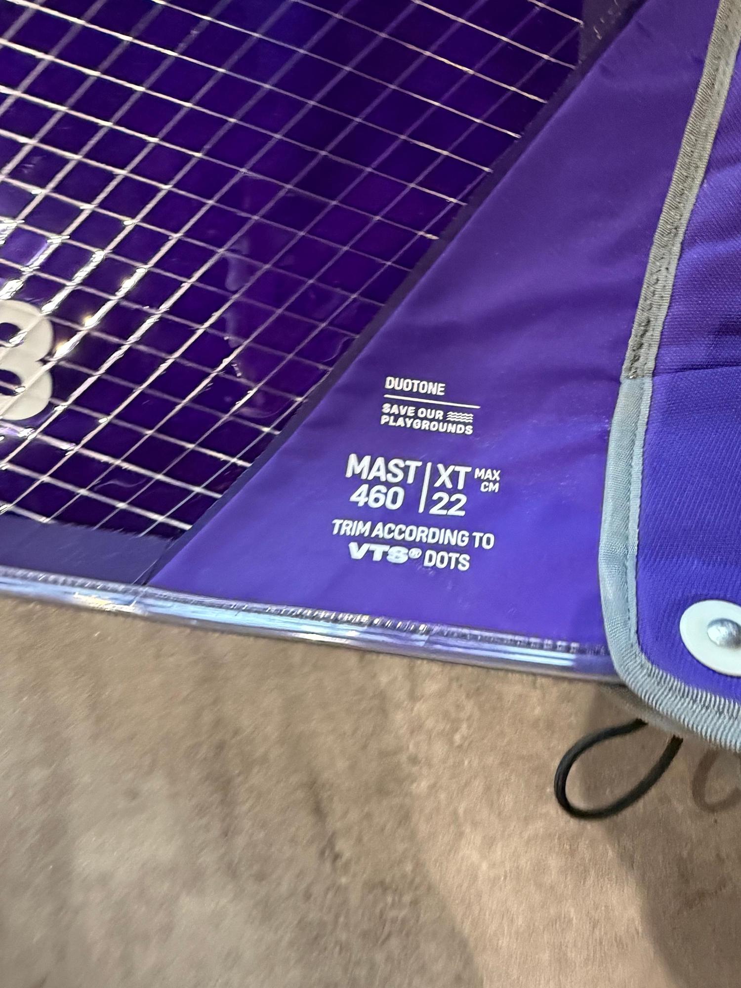 Purple Duotone X_Pace 7.3m windsurf sail detail showing mast and trim specifications on the reinforced sail fabric.